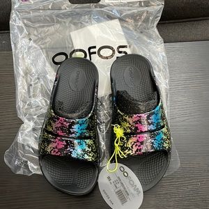 Women’s OOFOS slides 80s arcade